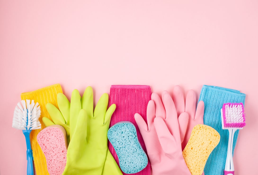 Detergents and cleaning accessories in pastel color. Cleaning service, small business idea. Top view.